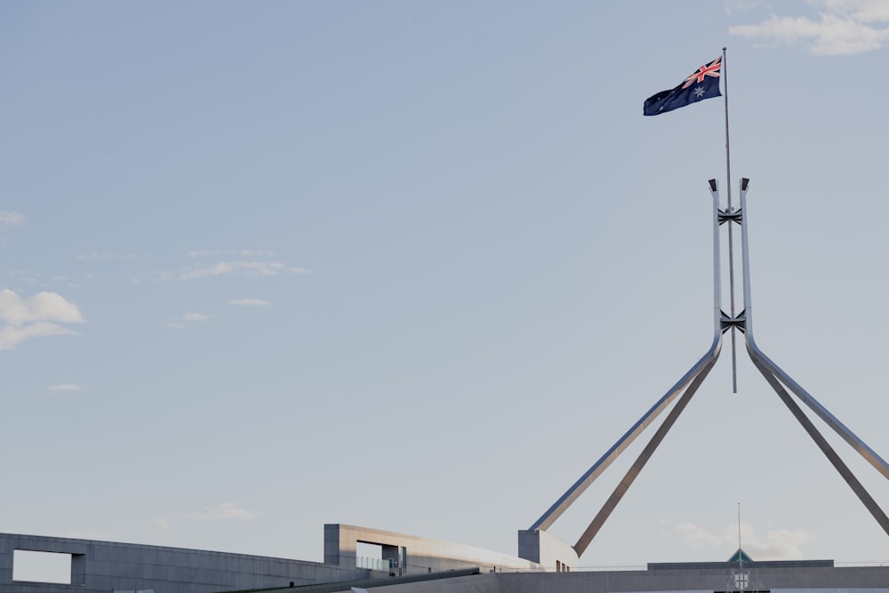 a flag is flying on top of a building