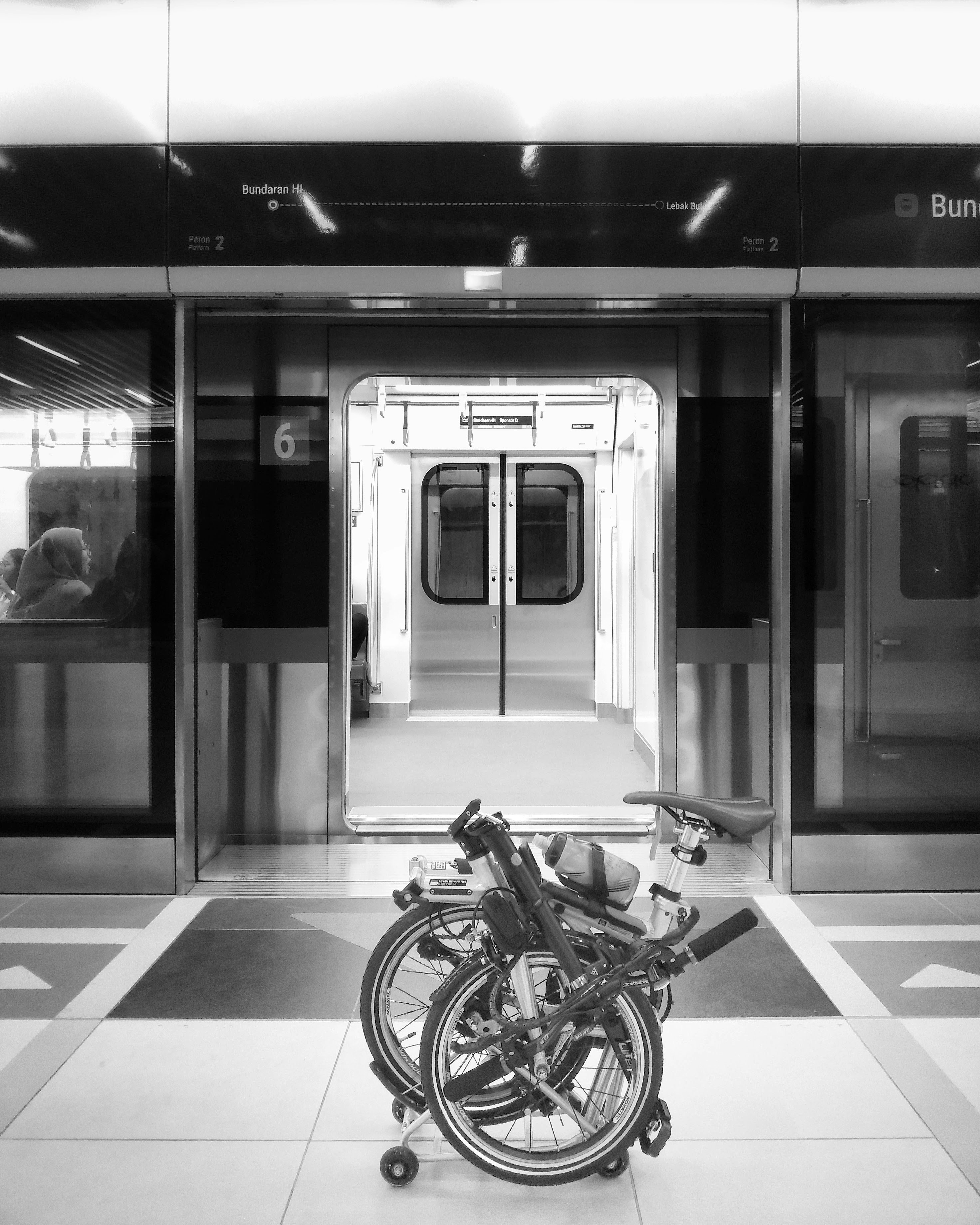 a bike parked in front of a train station