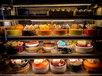 An assortment of beautifully decorated birthday cakes.