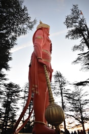 a statue of a man holding a large ball