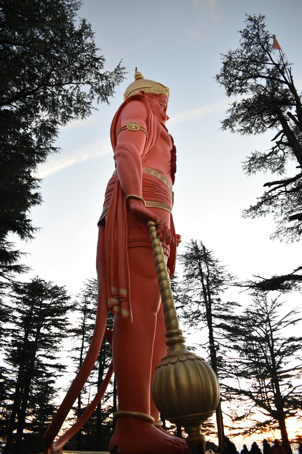 a statue of a man holding a large ball