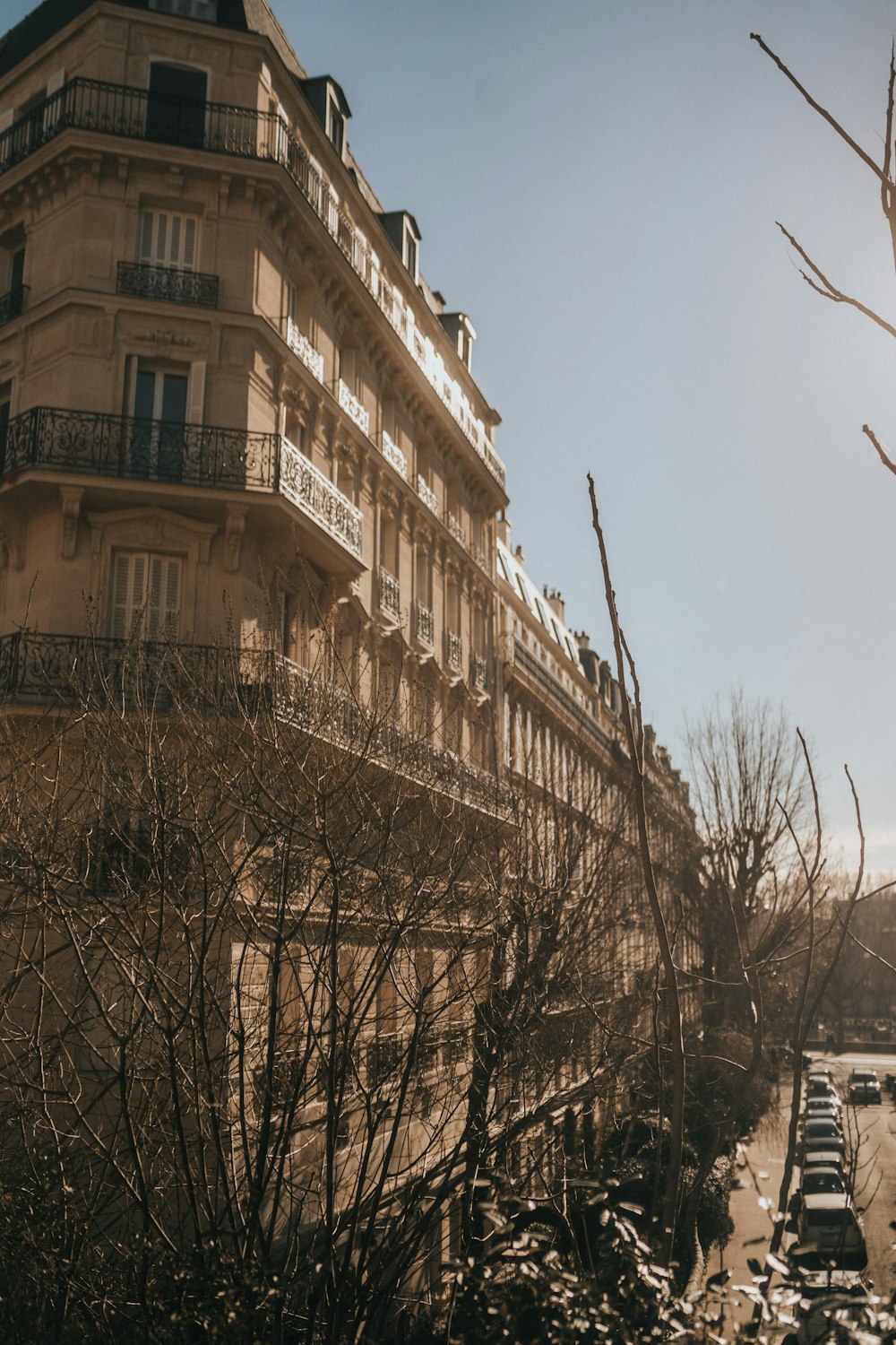 a very tall building sitting next to a bunch of trees