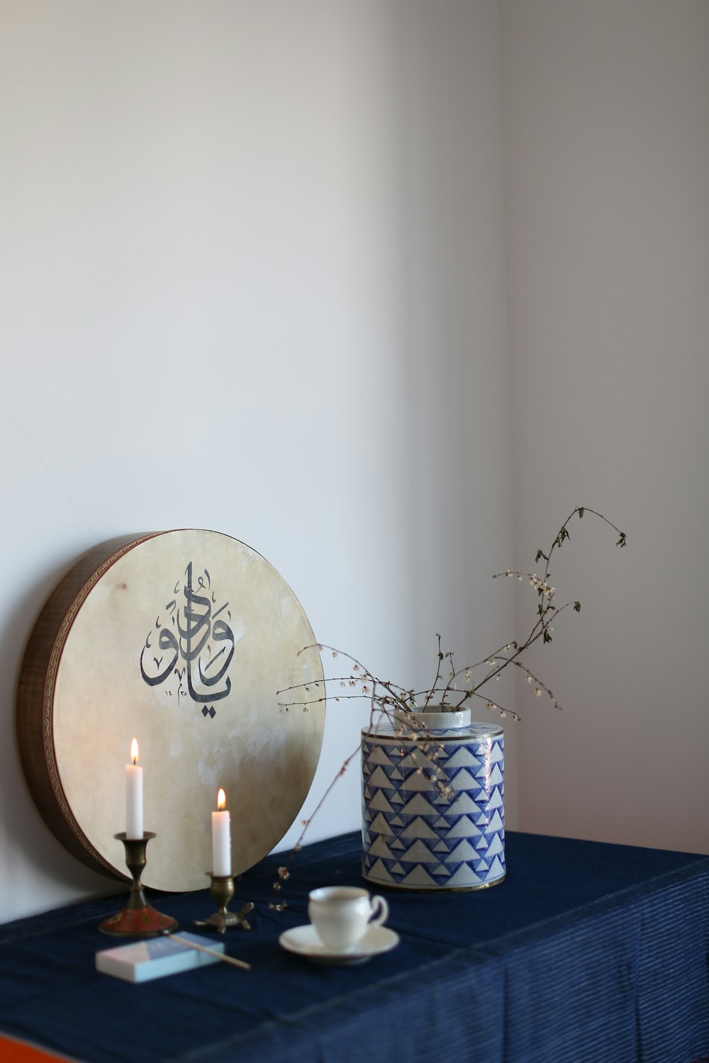 a table topped with a blue table cloth covered table