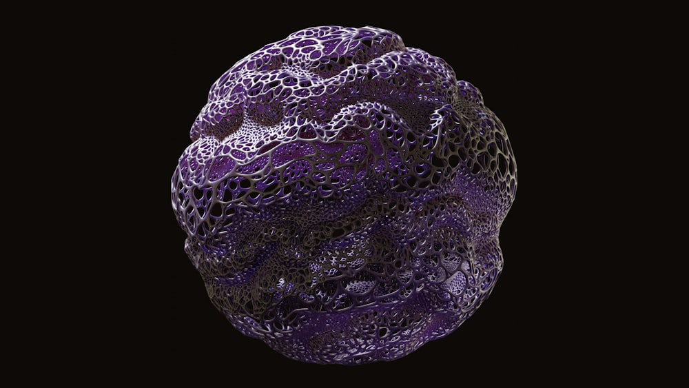 a purple ball of yarn on a black background