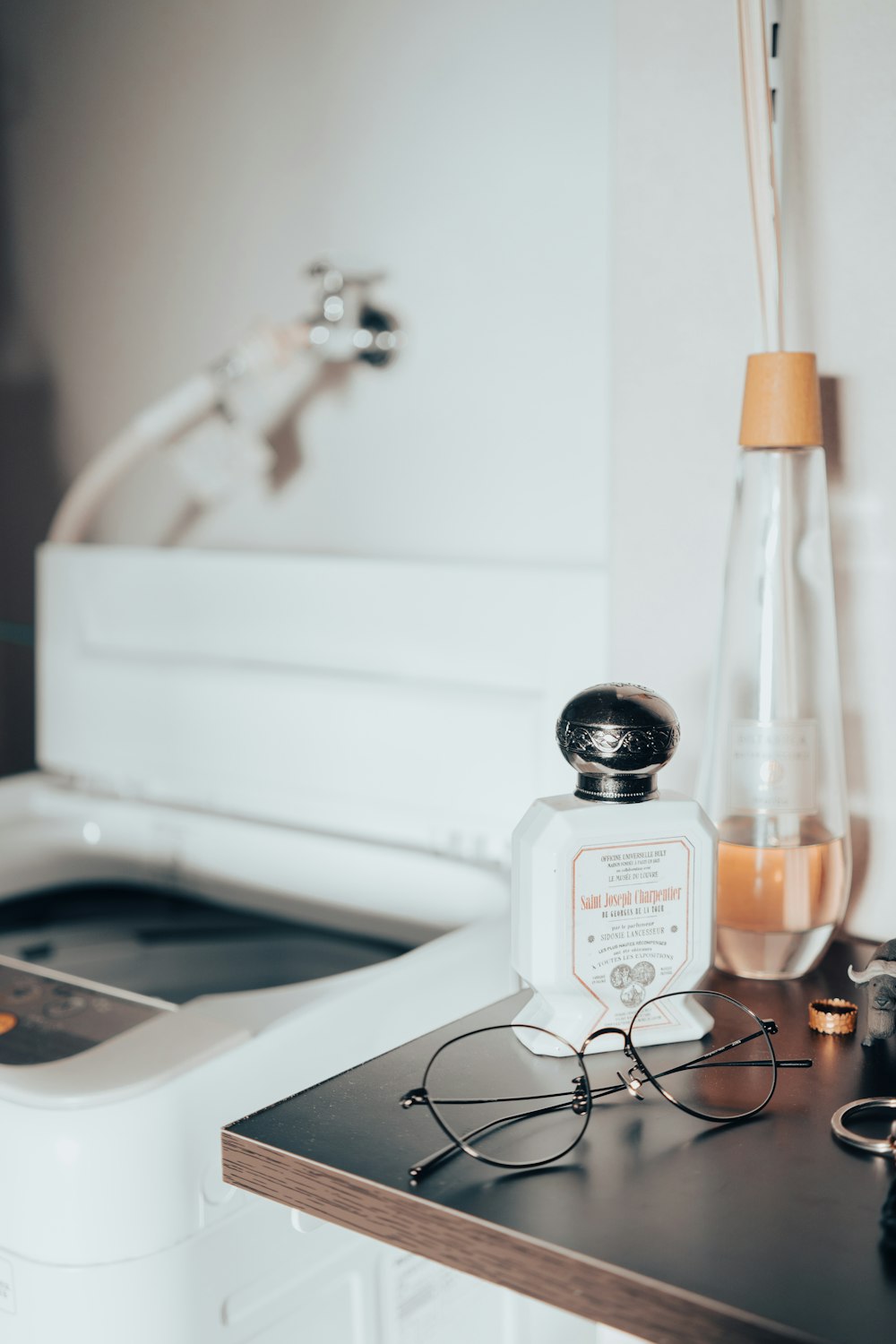 a pair of glasses sitting on top of a counter