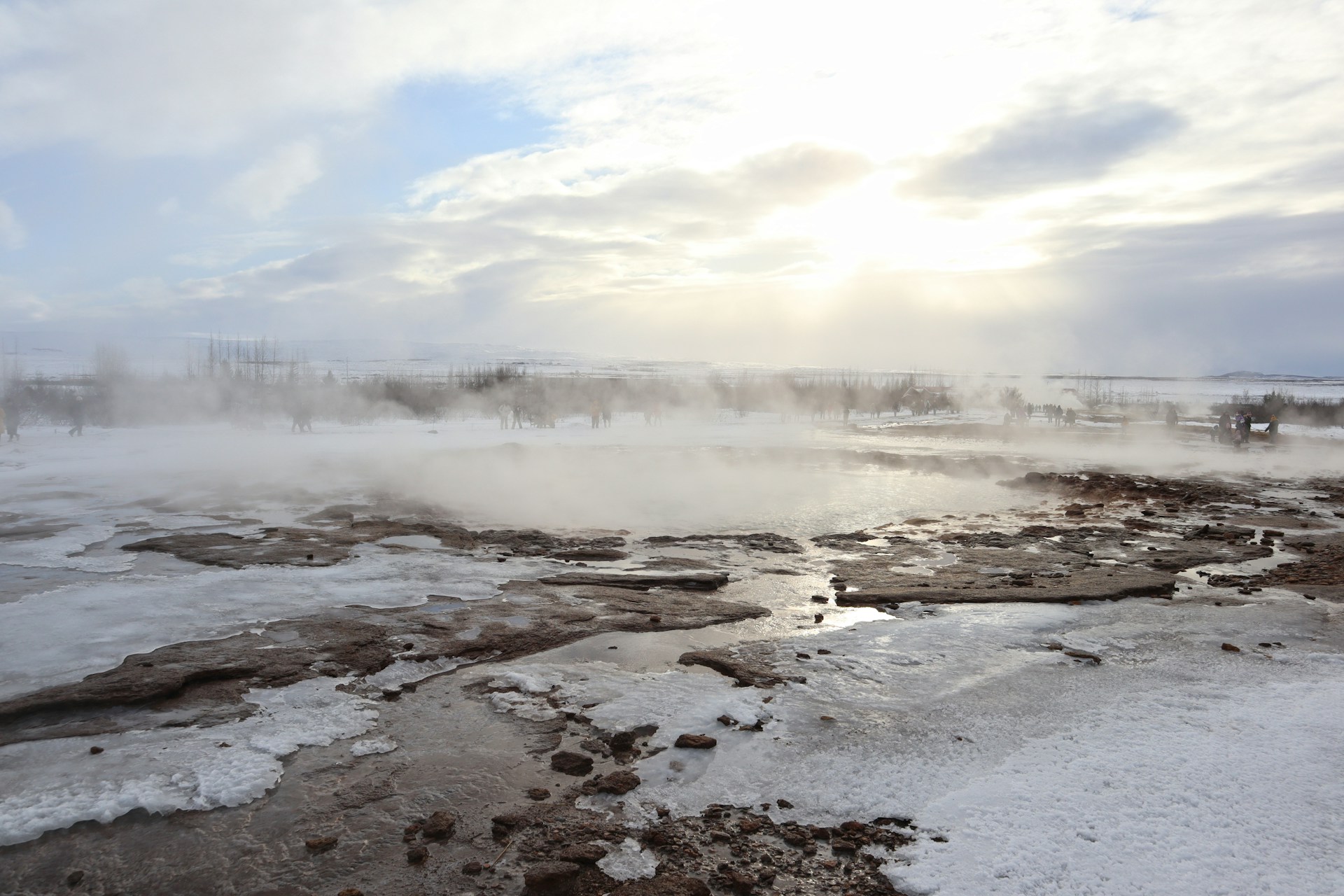 a geyser spewing out steam into the air
