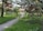 A serene garden with blooming flowers and a tranquil pathway.