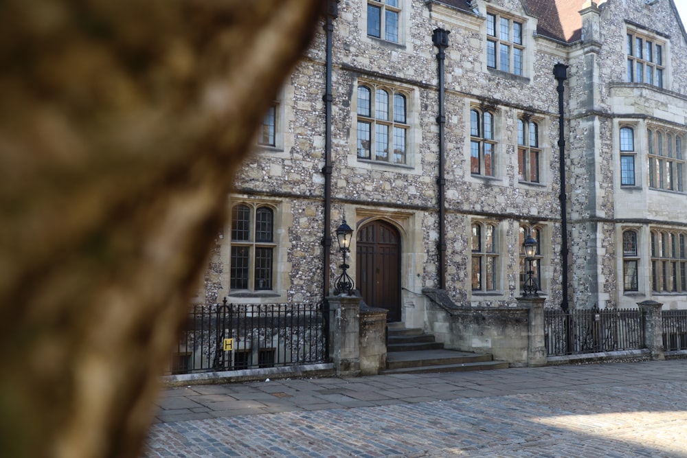 a large stone building with a clock on the front of it