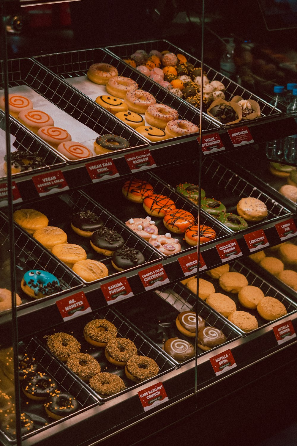 a display case filled with lots of different types of donuts