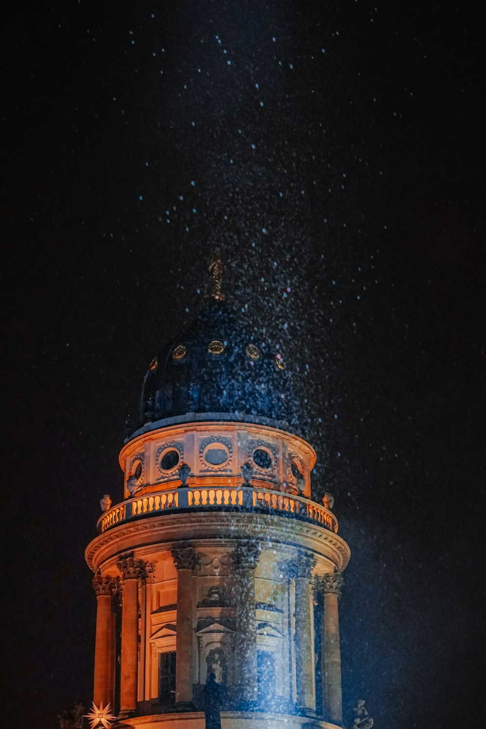 a tower with a clock on it at night