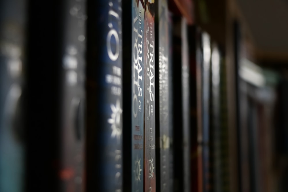 a row of books sitting on top of a shelf