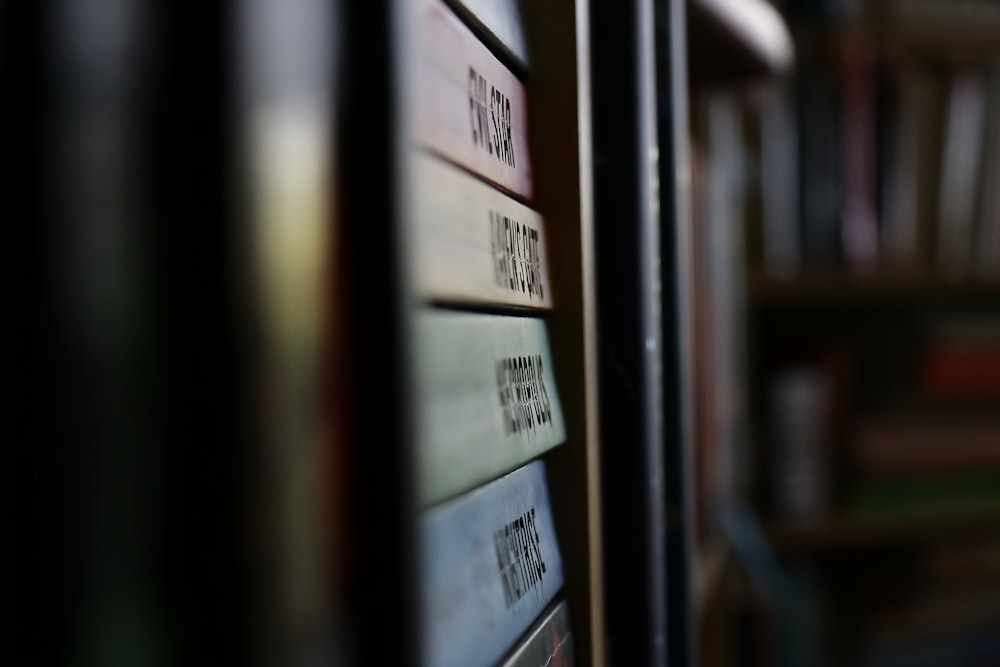 a close up of a book shelf with books on it