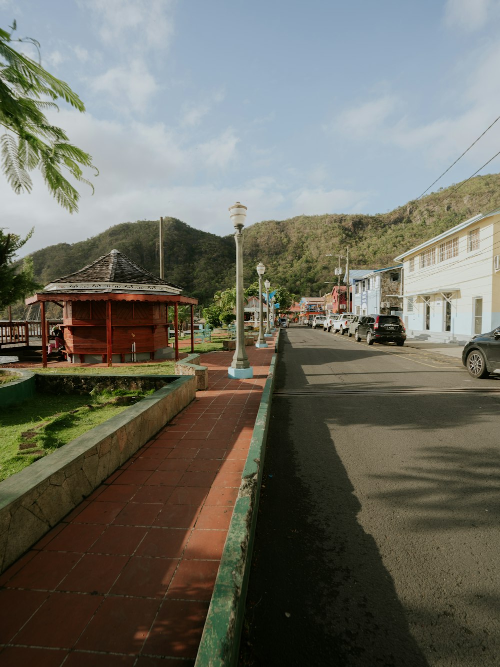 a street with cars parked on the side of it