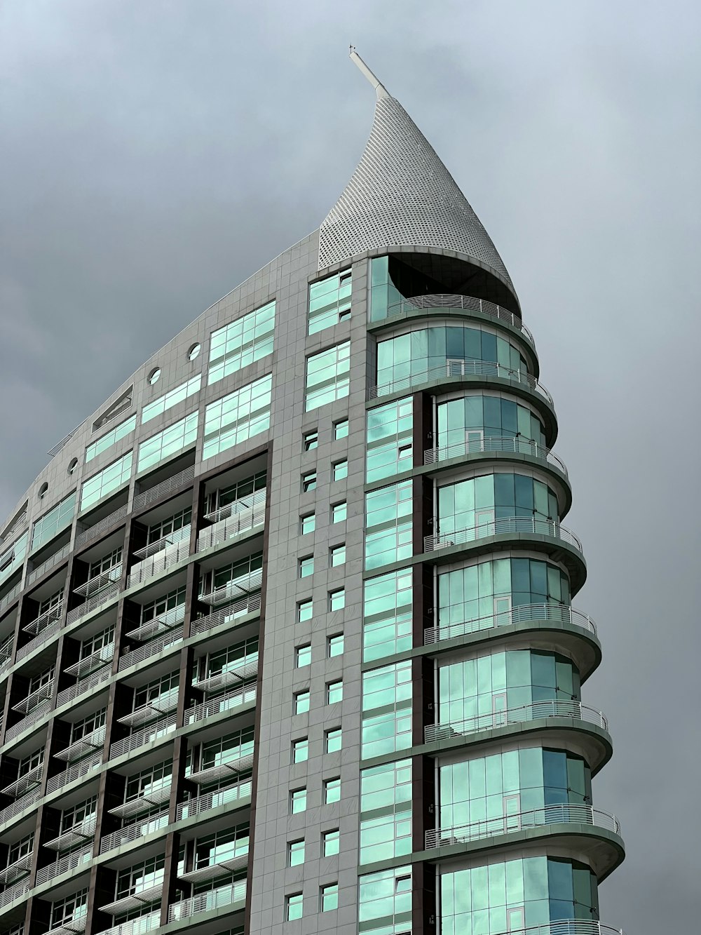 a very tall building with a sky background