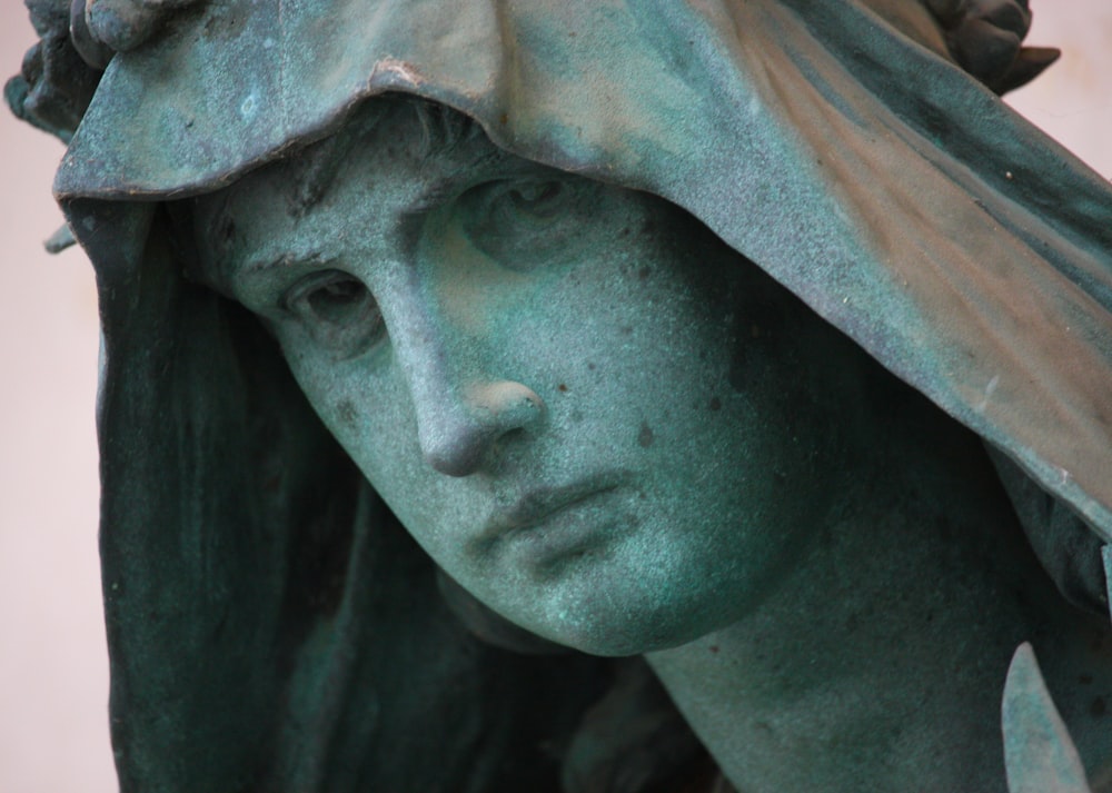 a close up of a statue of a woman's head