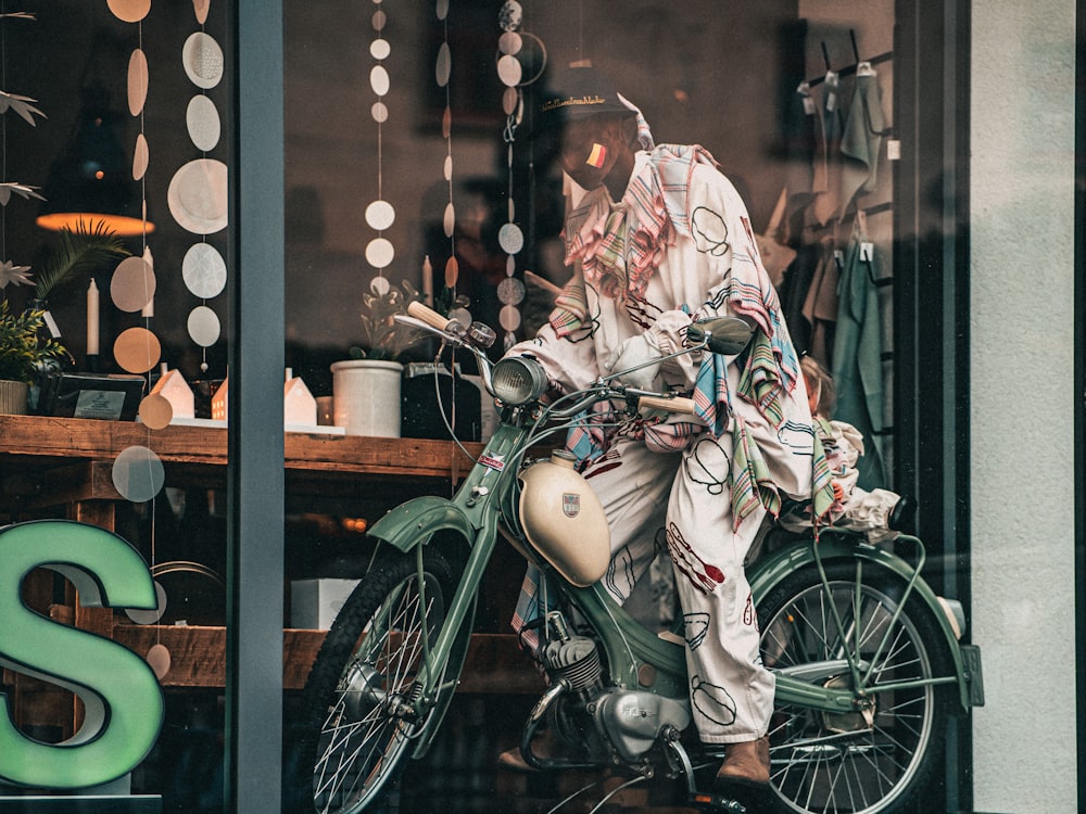 a motorcycle parked in front of a store window