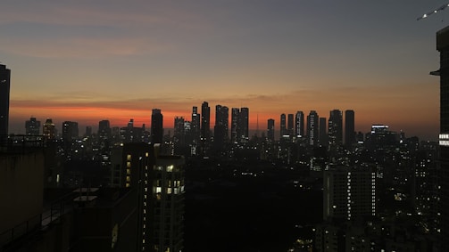 a view of a city at night from a high rise building