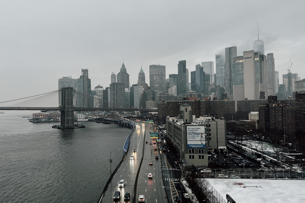 a view of a city skyline with a bridge in the foreground