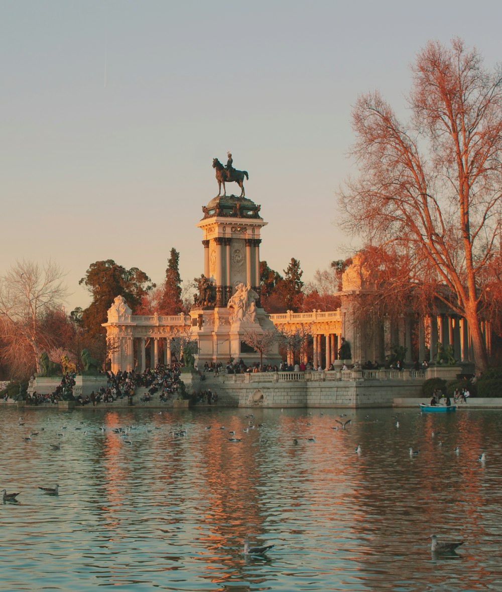 a large body of water with a statue on top of it