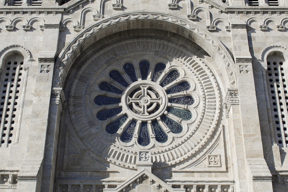 a large stone building with a clock on it's side