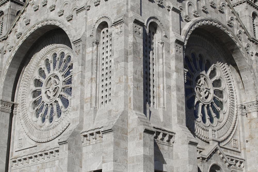 a large stone building with a clock on it's side