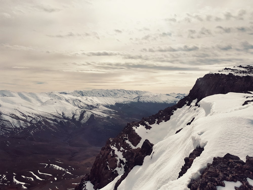 a person on a snowboard on top of a mountain