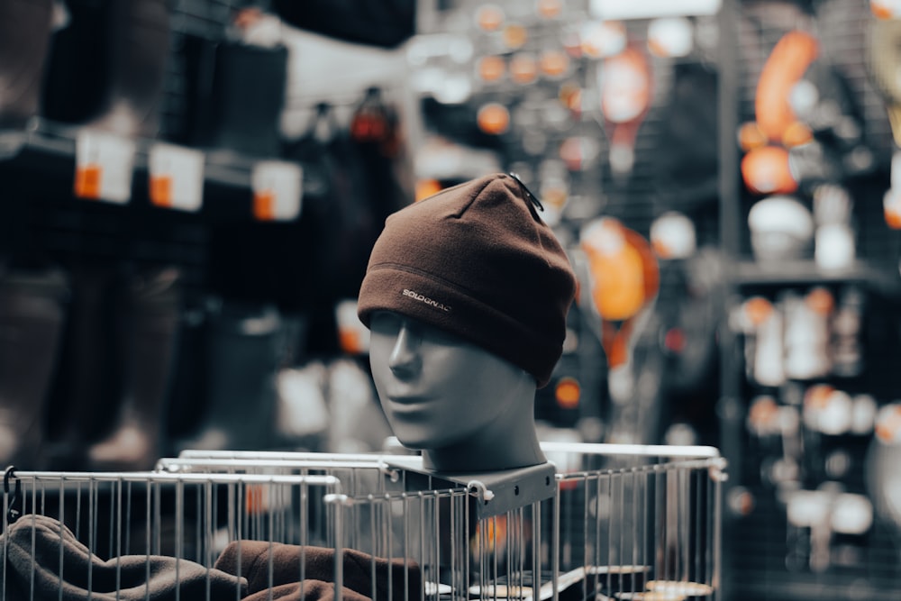 a mannequin's head with a hat on top of it