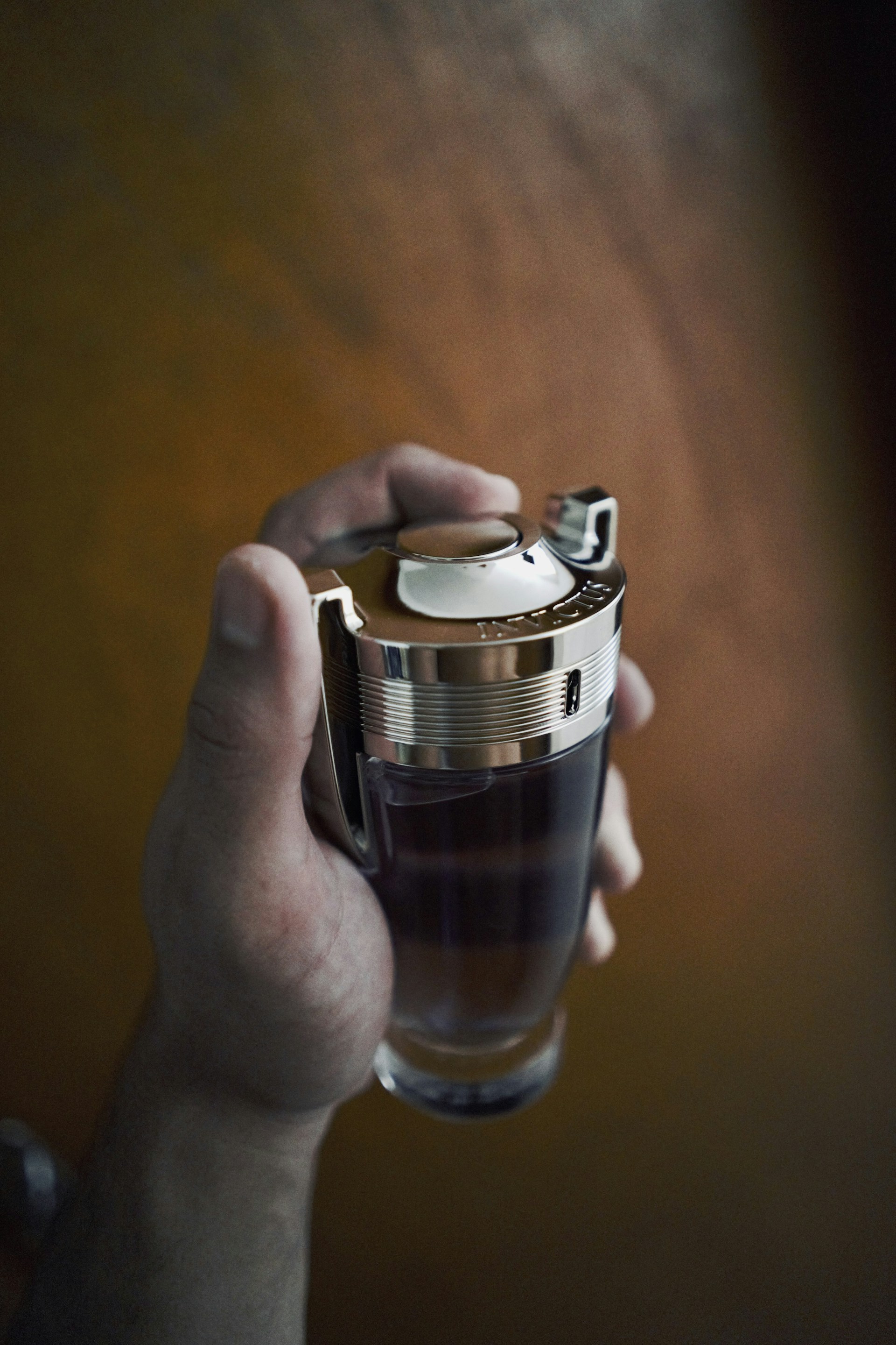 a person holding a coffee cup in their hand