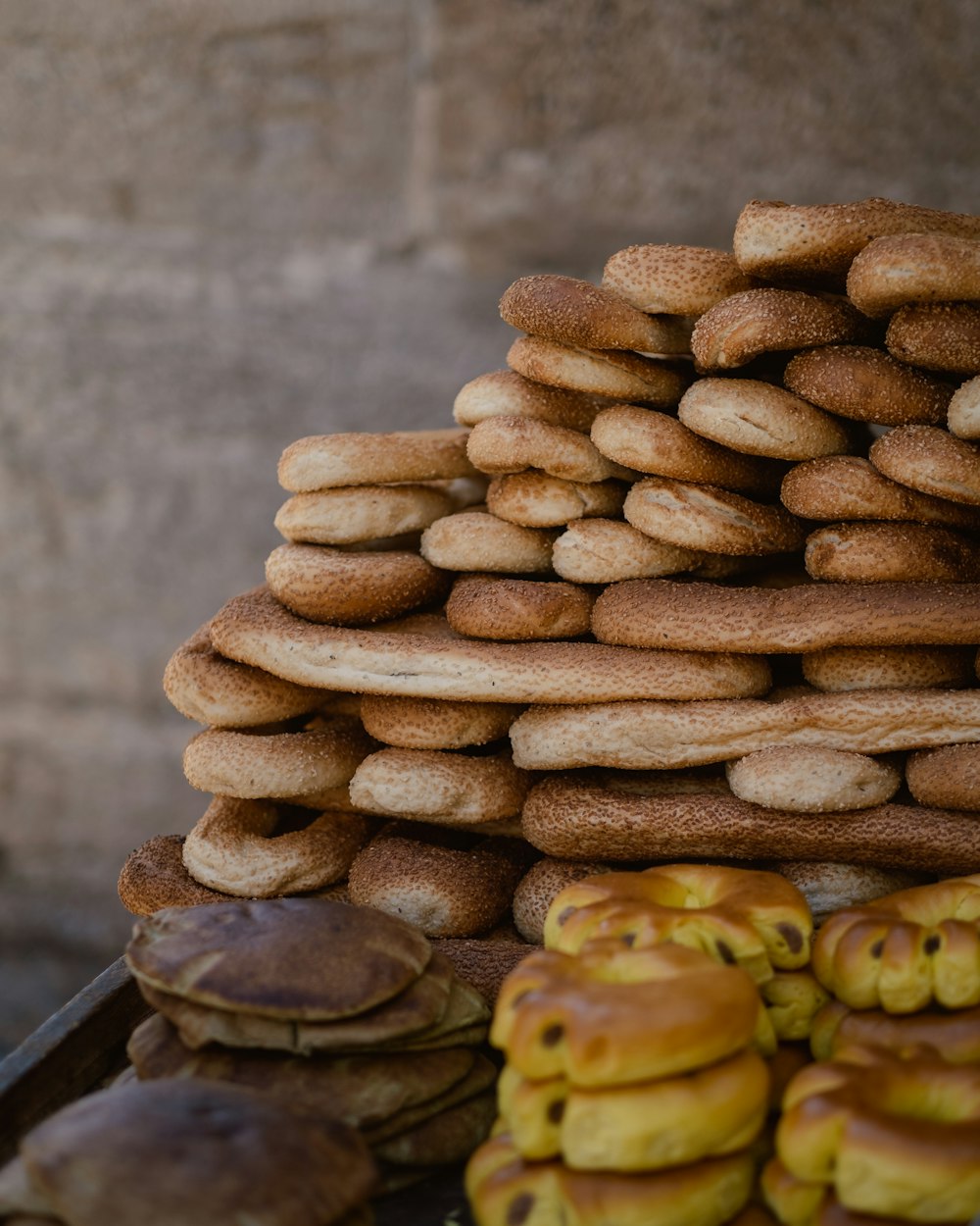 a stack of donuts sitting on top of a table