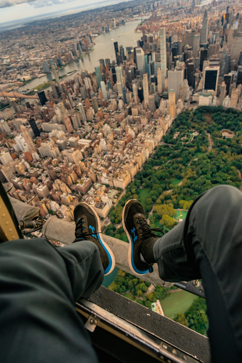 a person standing on the edge of a tall building