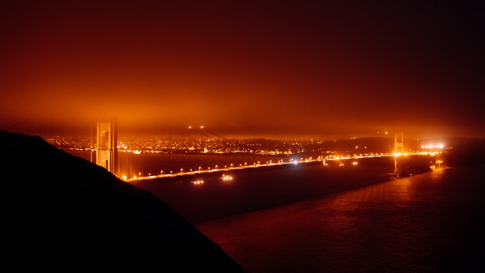 a night view of a city and a bridge