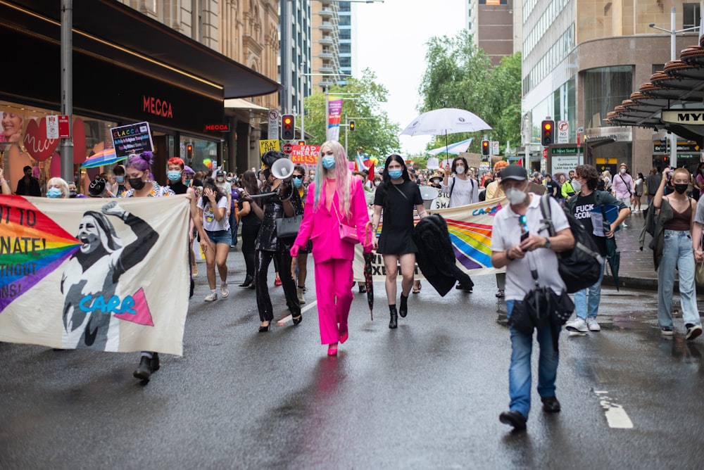 a group of people walking down a street