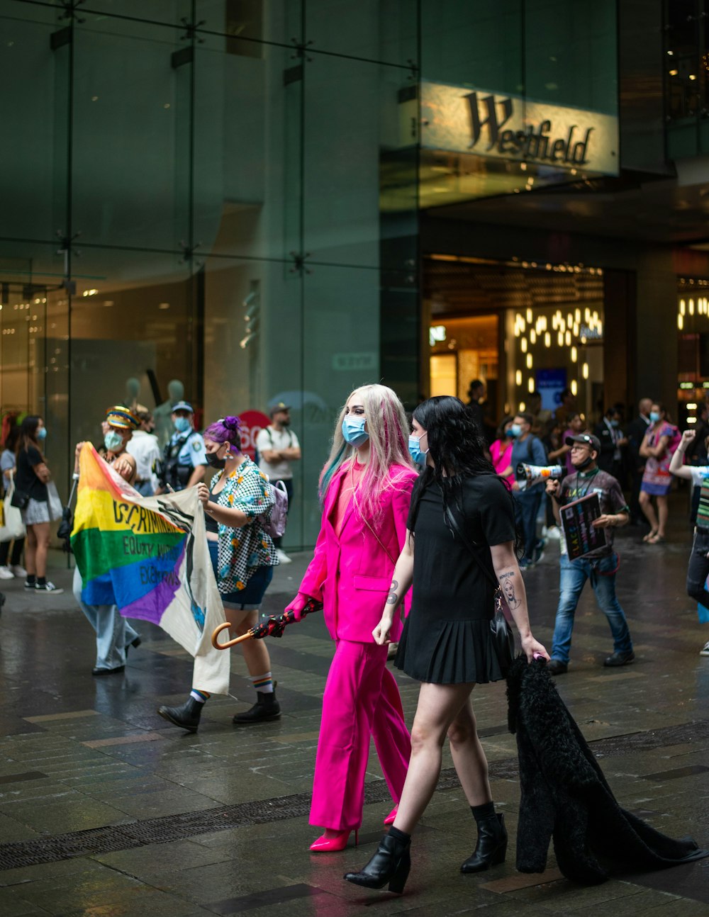 a group of people that are standing in the street