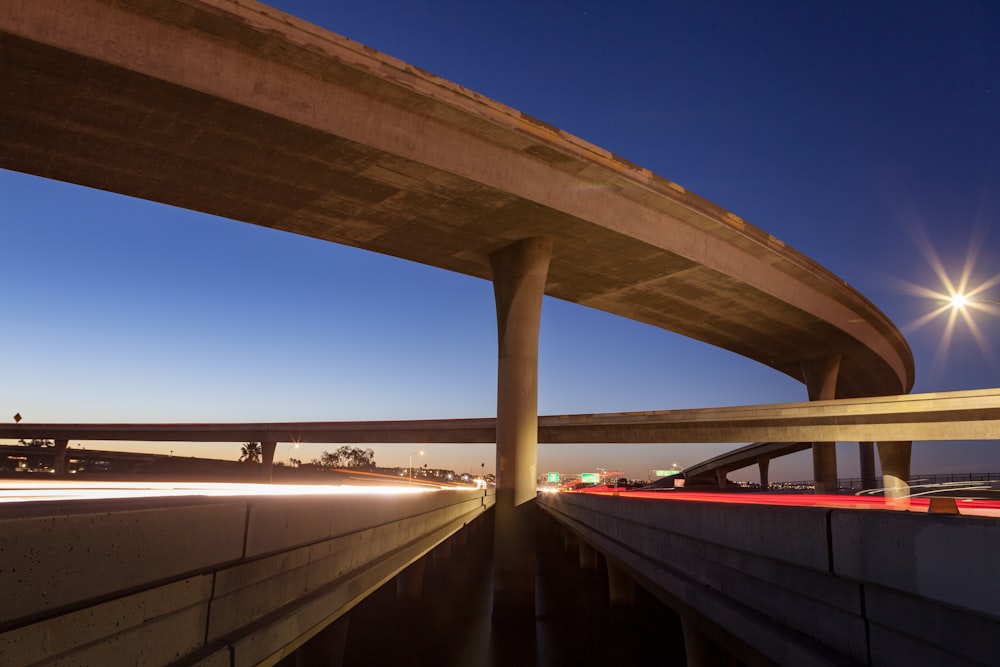 a view of a highway with a bridge in the background