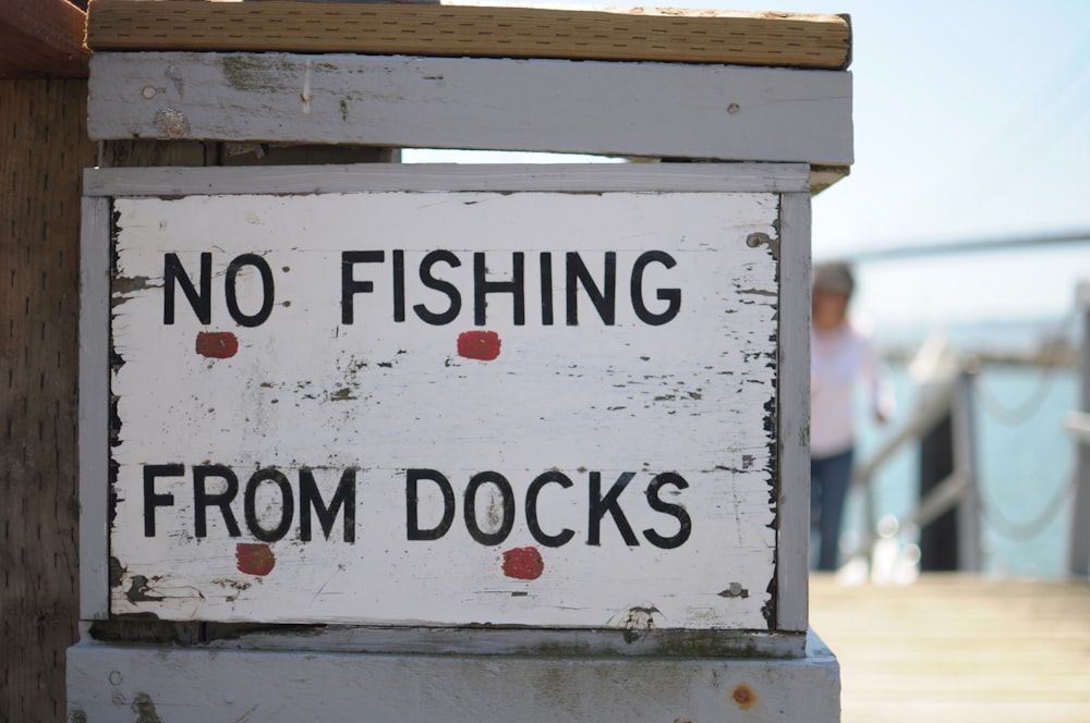 a no fishing from docks sign on a dock