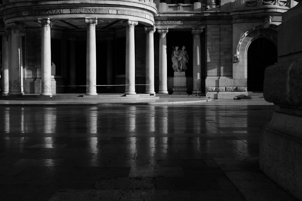 a black and white photo of a building with columns