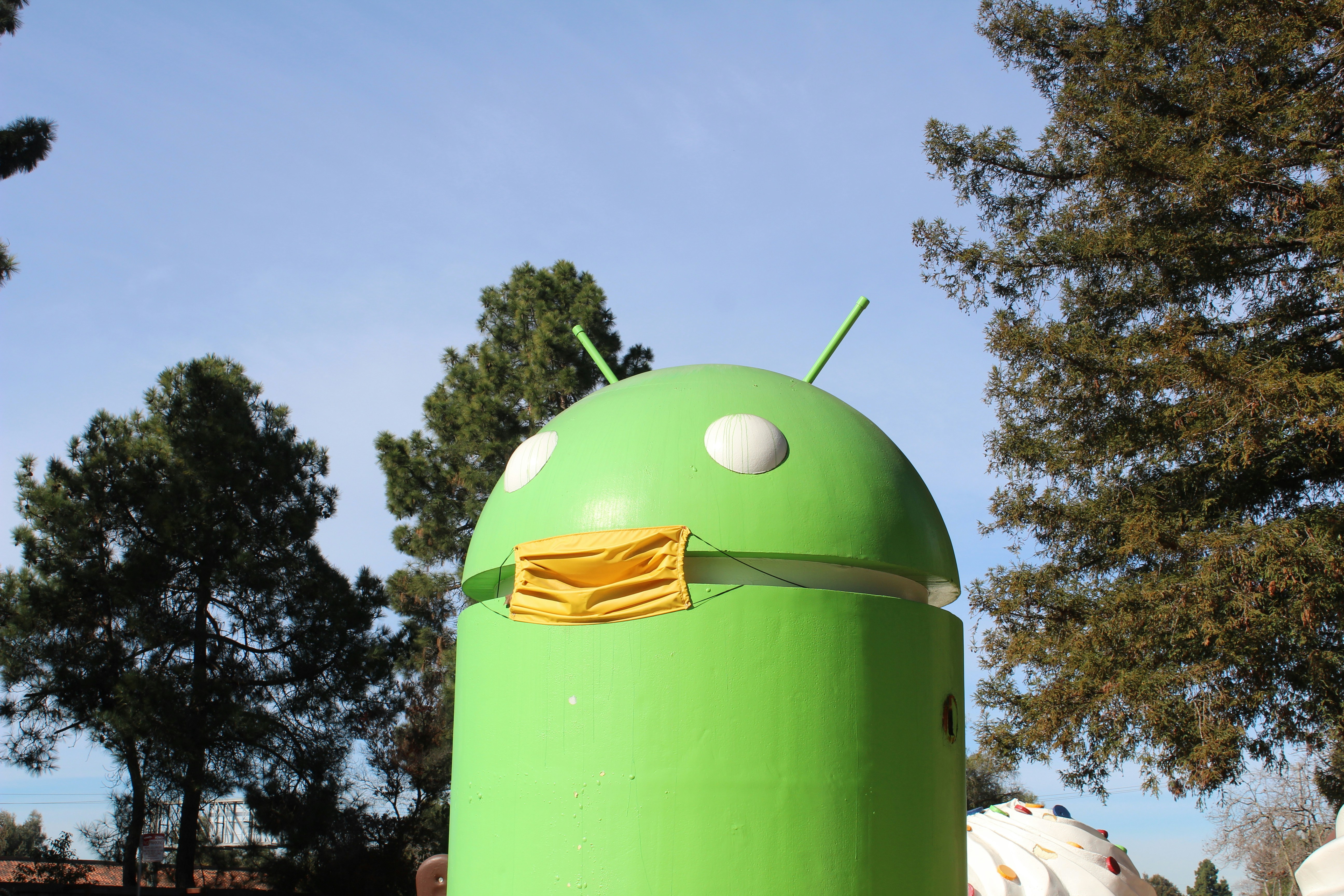 a large green object with a yellow cloth on it
