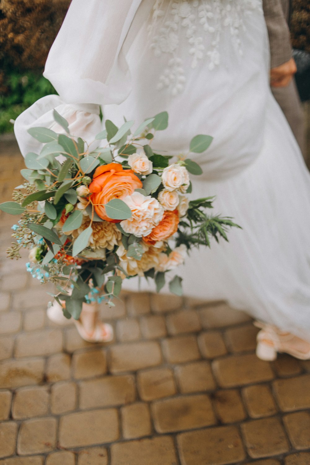 a bride holding a bouquet of flowers on her wedding day