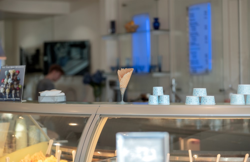 a display case in a bakery filled with lots of food