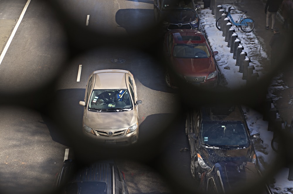 a car is seen through a wire fence