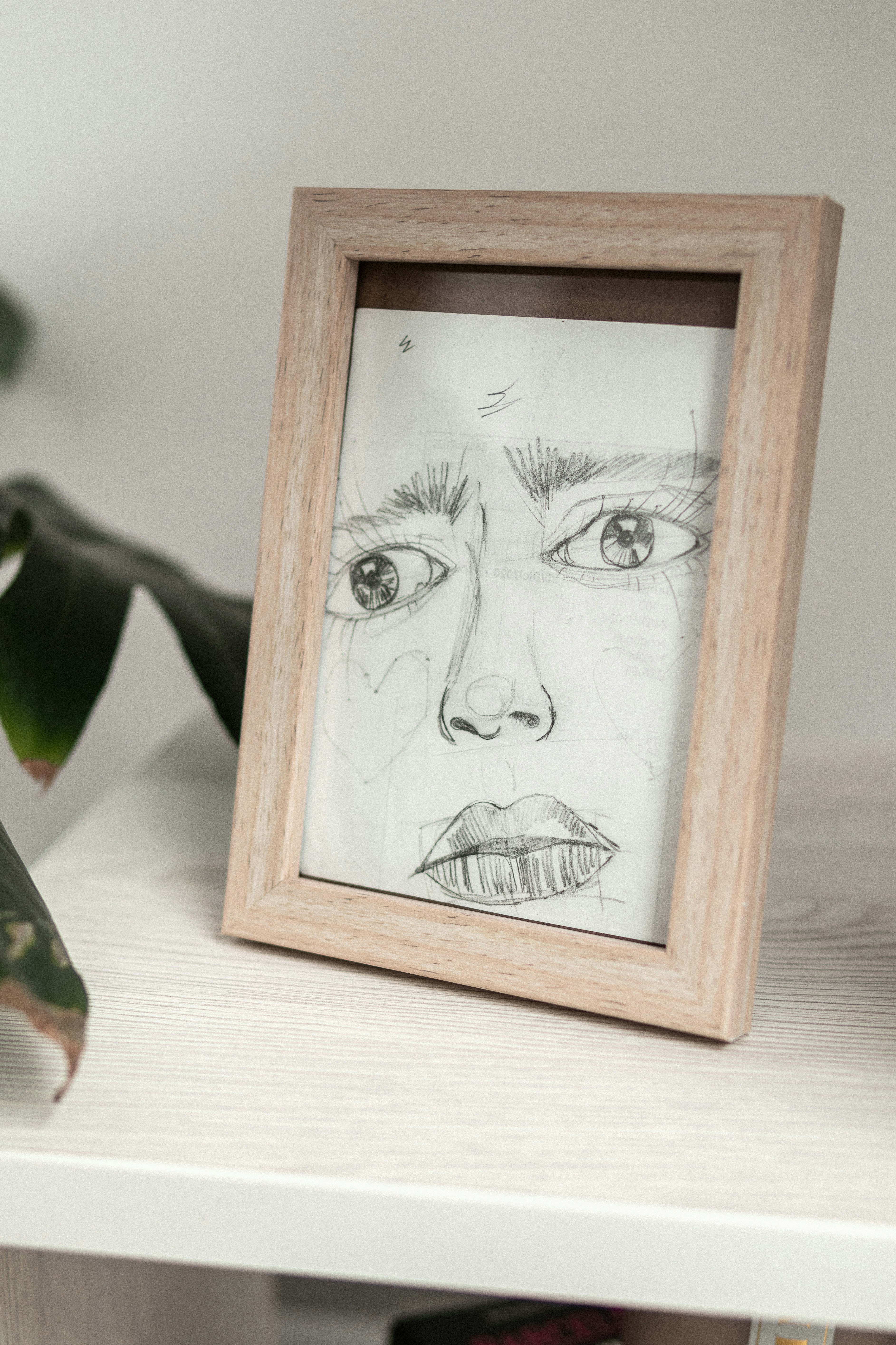 a picture frame with a drawing of a woman's face