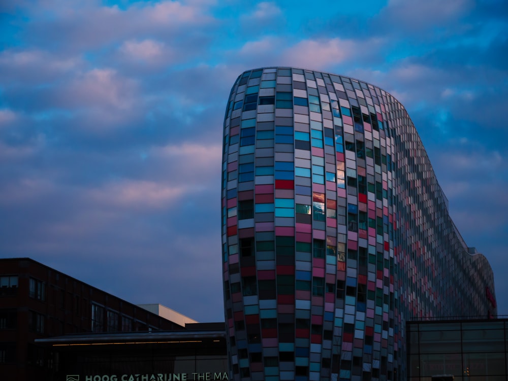 a multicolored building with a sky background