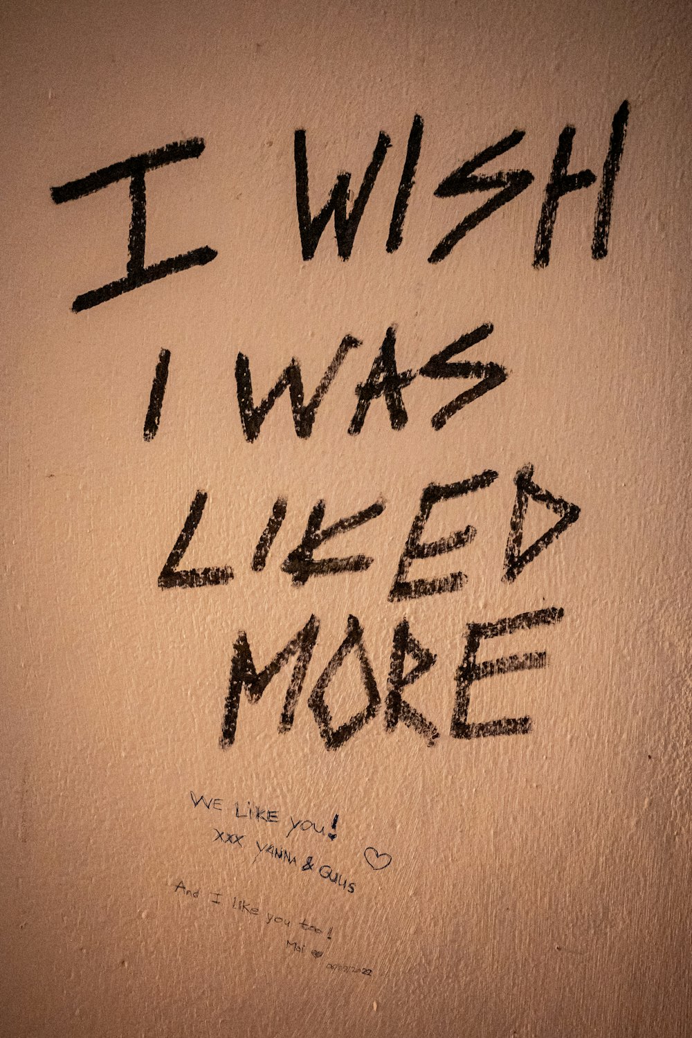 graffiti written on a wall that says i wish i was liked more