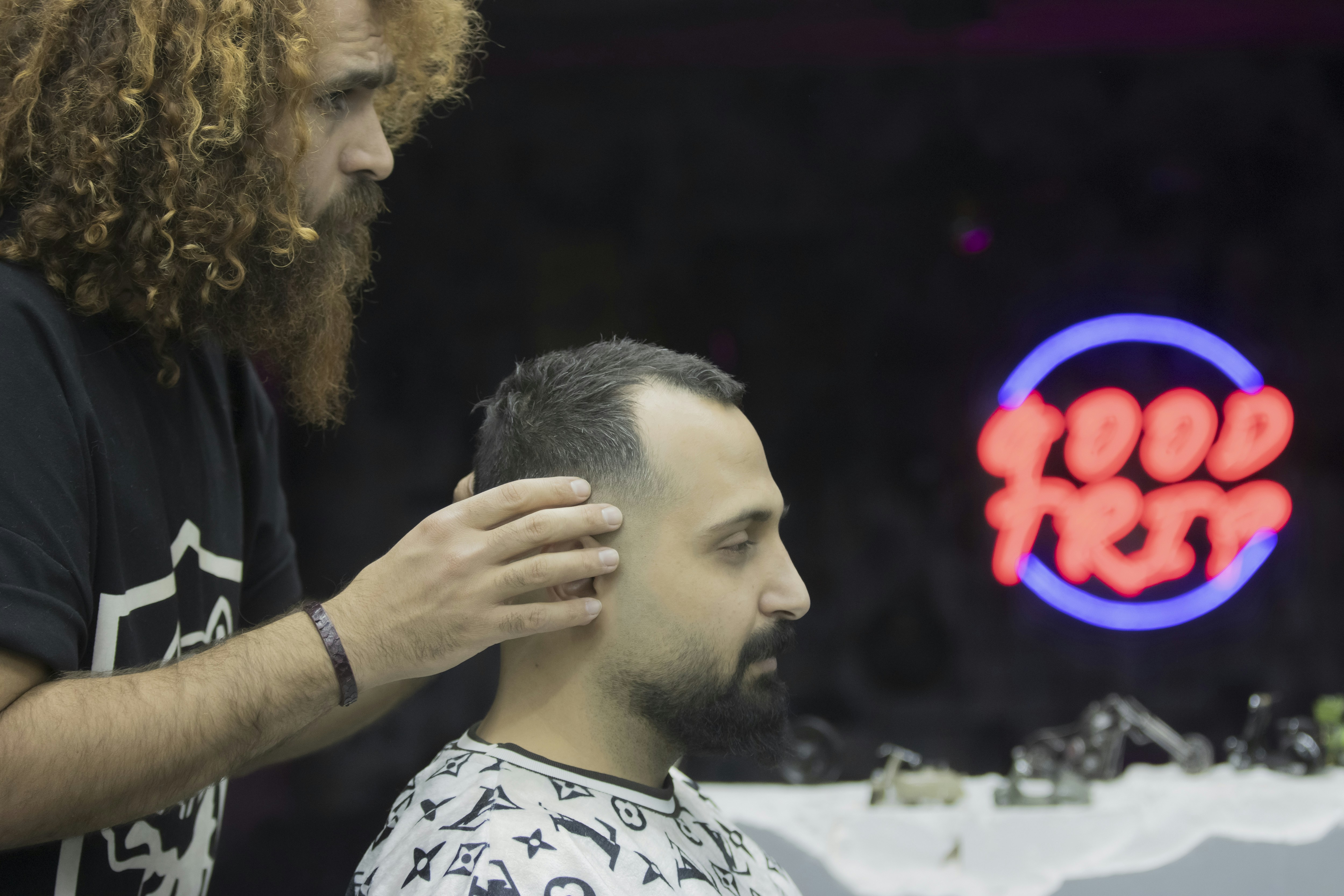 Stylist working on curly hair