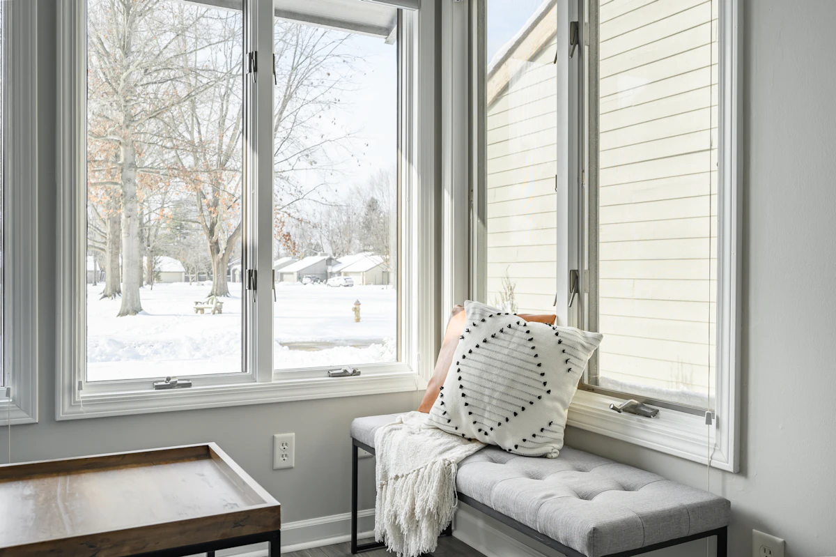 Window shutters beside a window seat