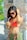 a woman in a bikini holding a coconut