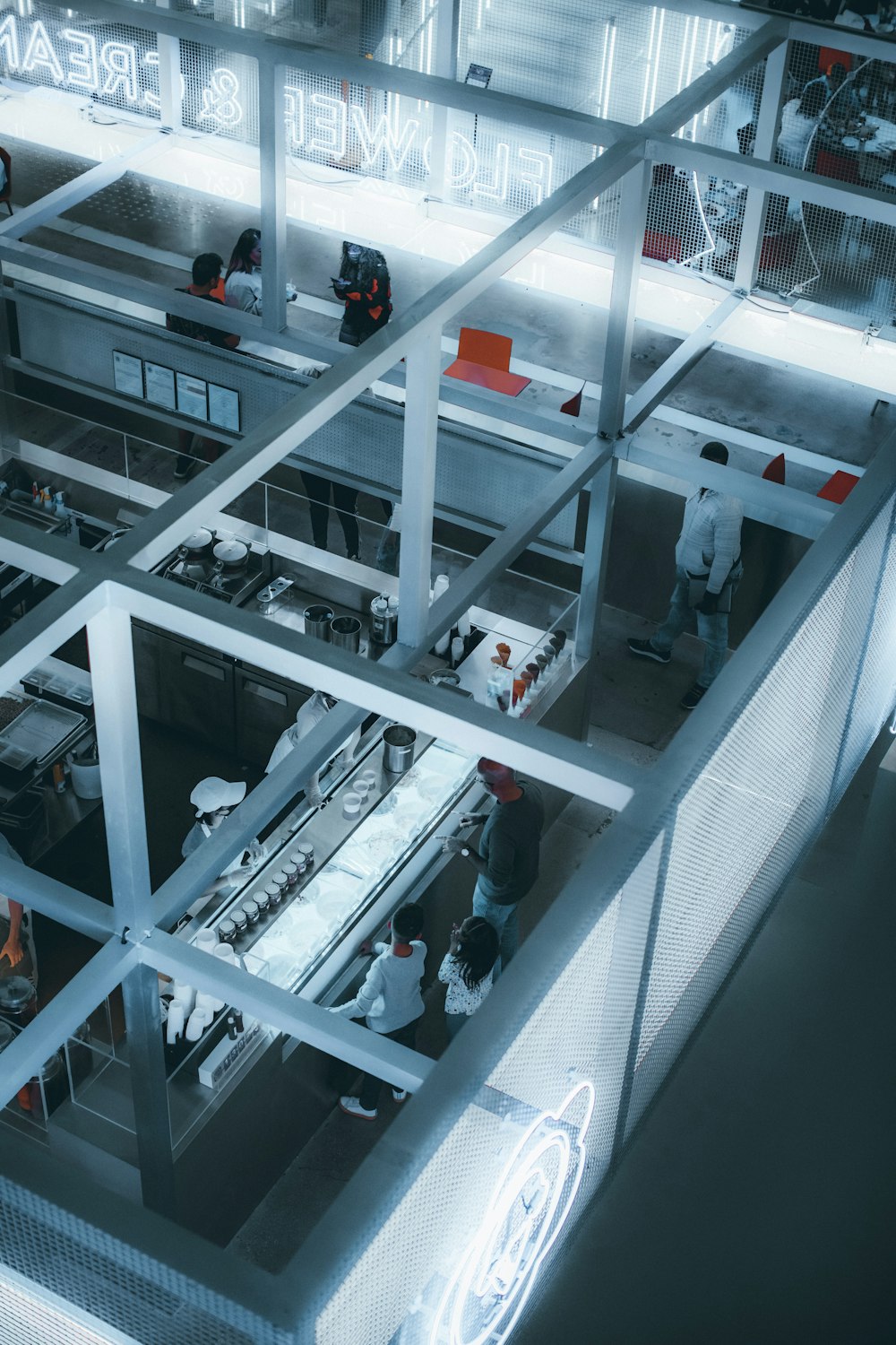 an overhead view of a factory with workers and machinery