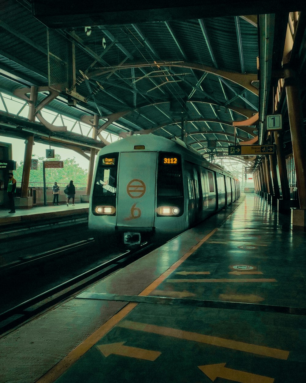 a subway train pulling into a train station