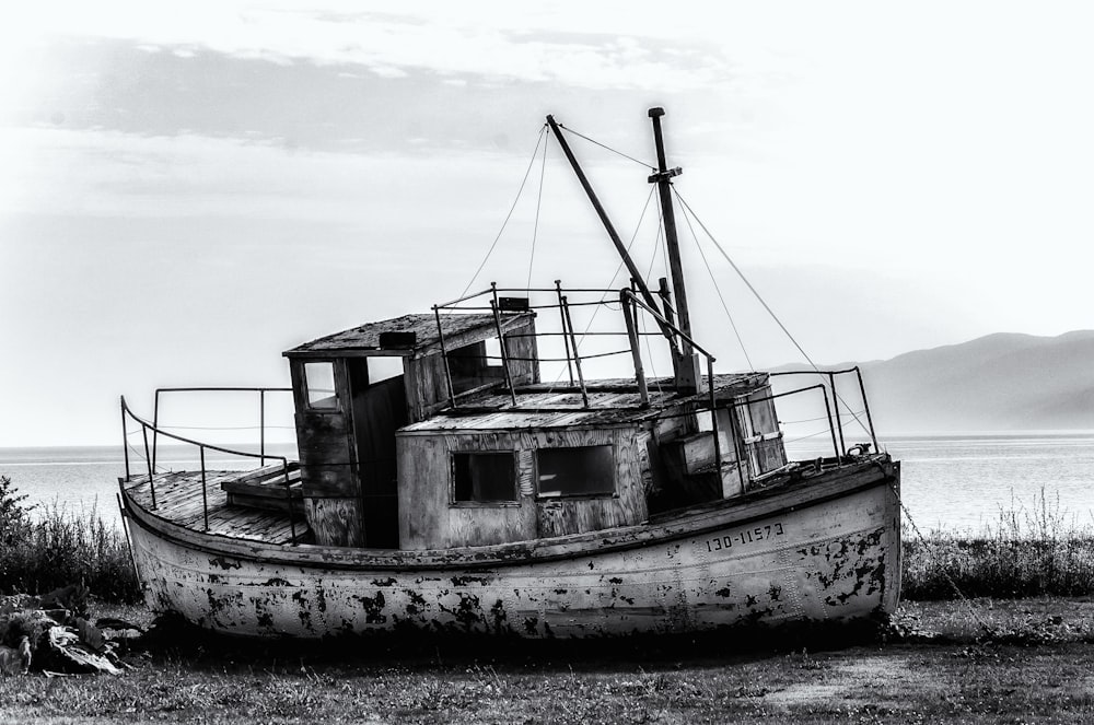 a black and white photo of an old boat