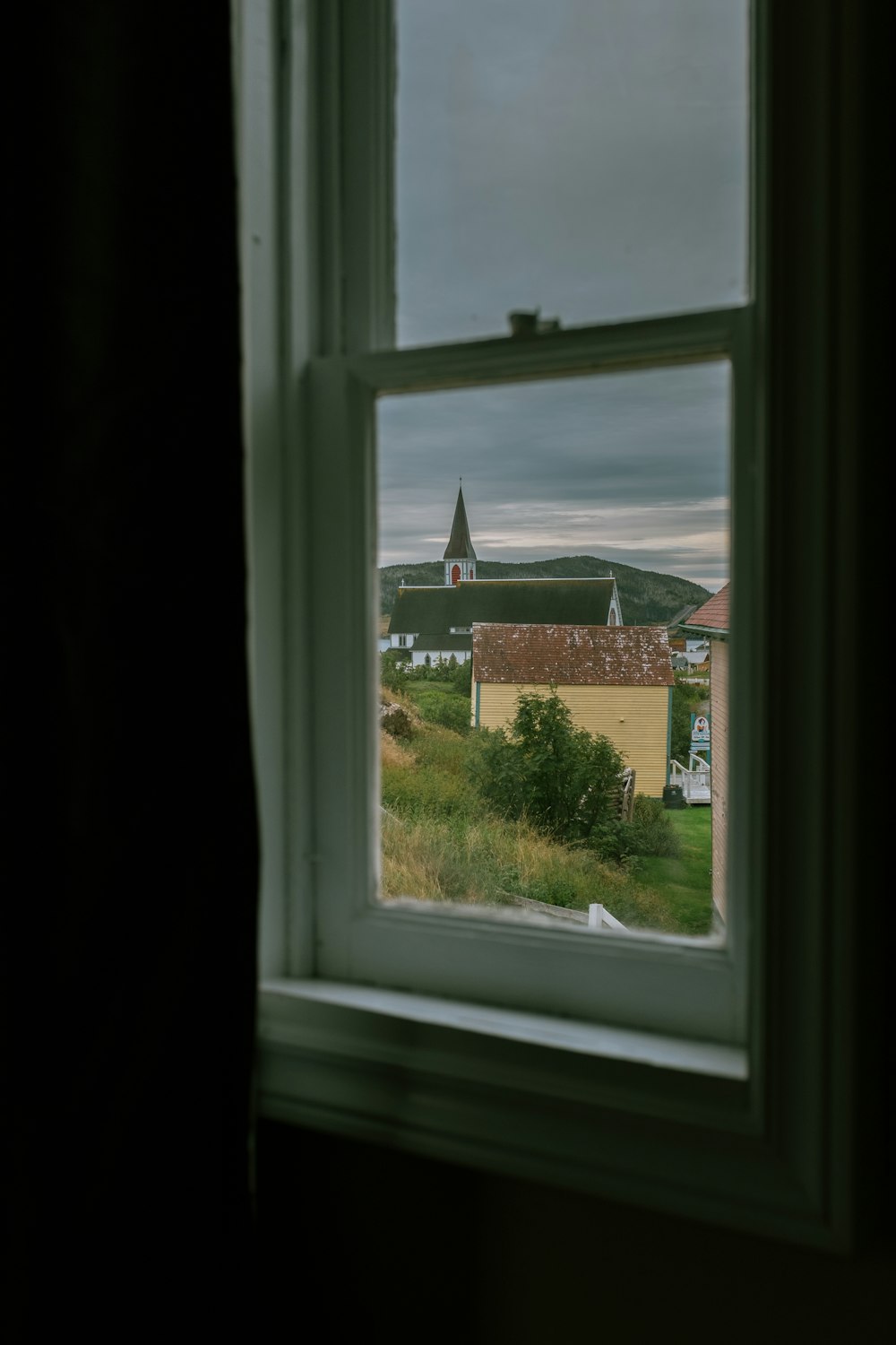 a window with a view of a small town